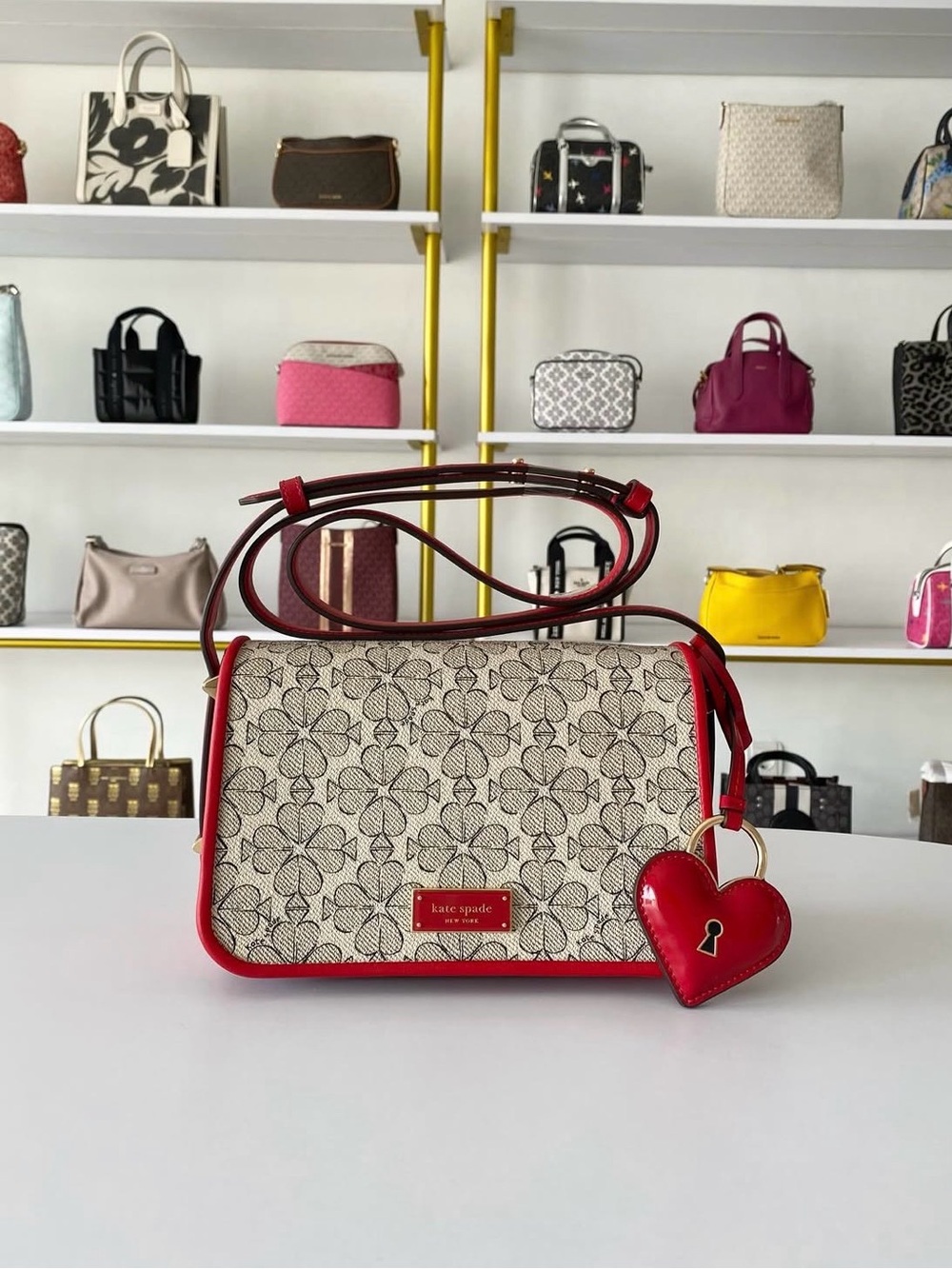 kate spade Cream Floral Print Crossbody with Red Trim and Heart Charm